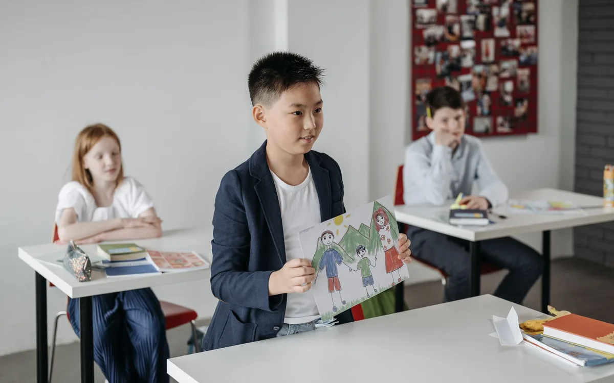 School children working at desks in a classroom