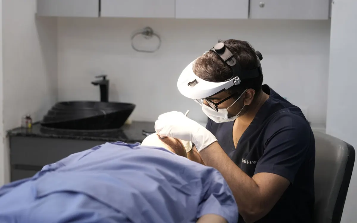 A dermatologist examining a patient at a clinic.