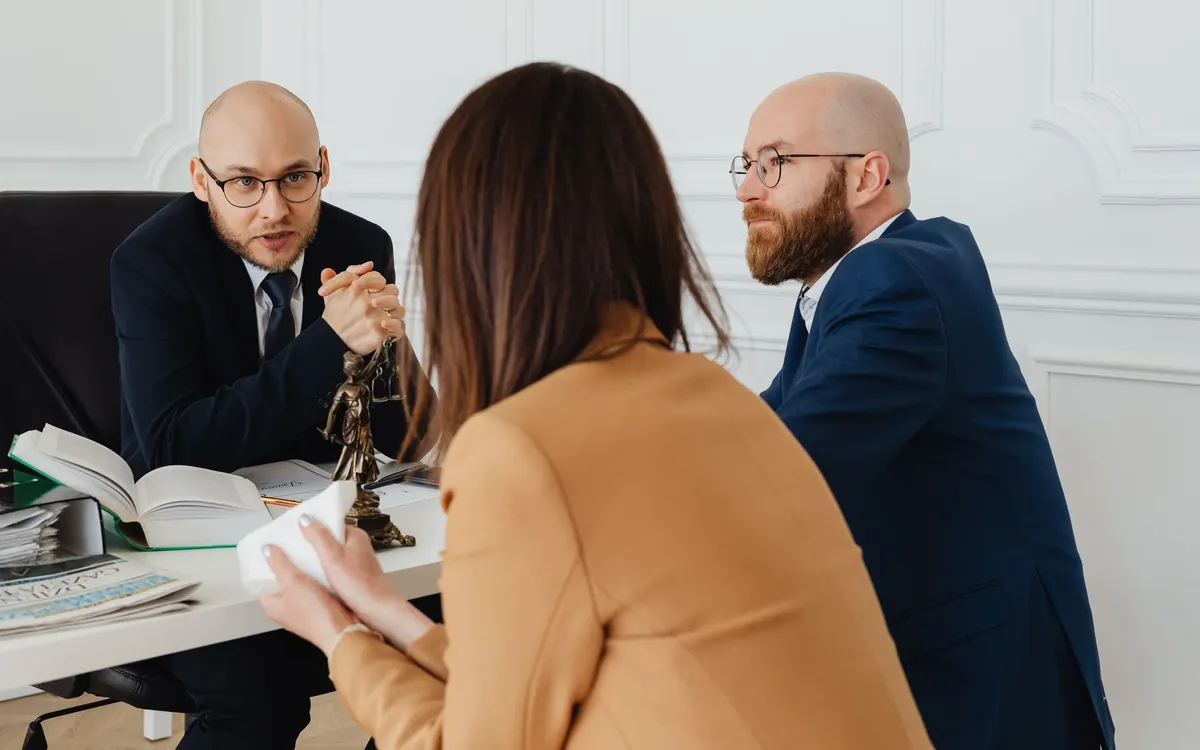 A legal consultation in an office.