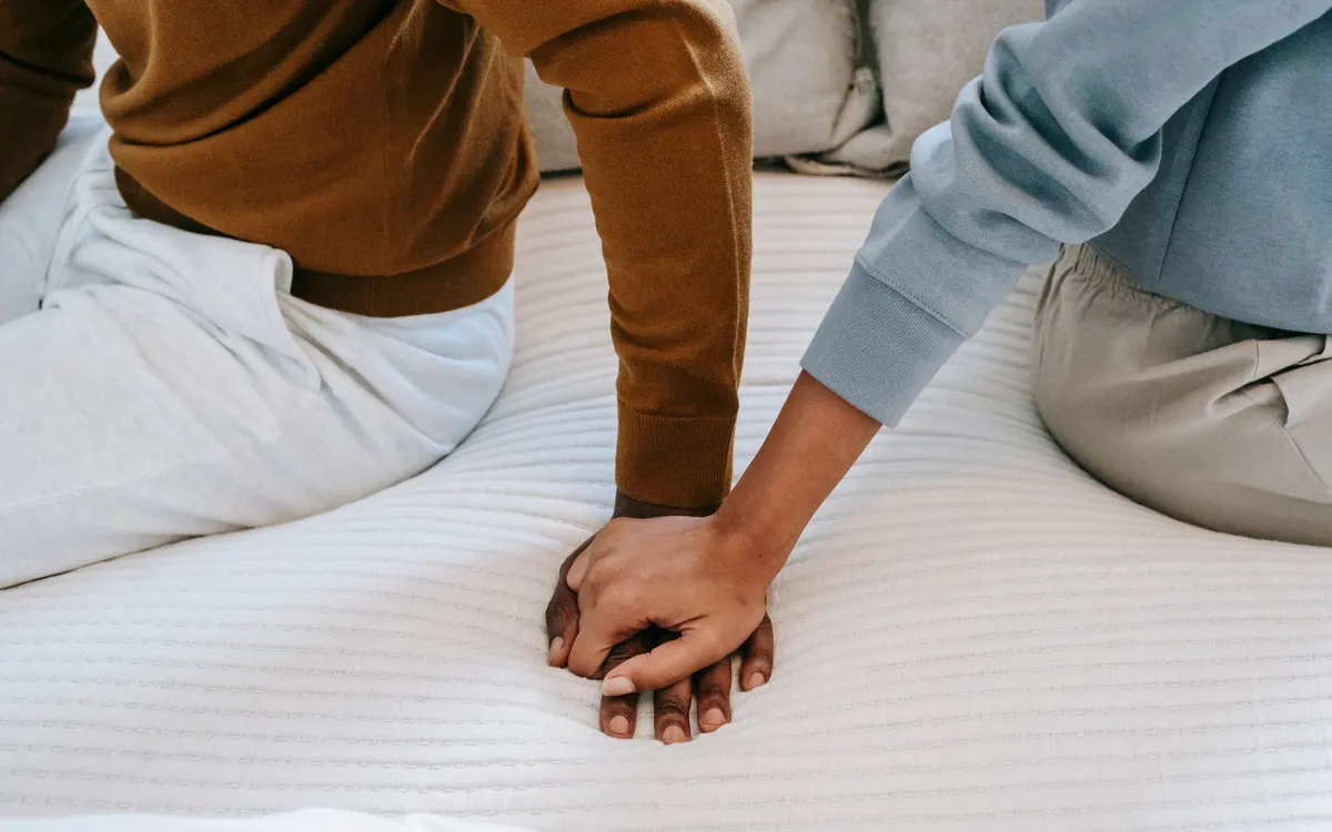 A couple holding hands.