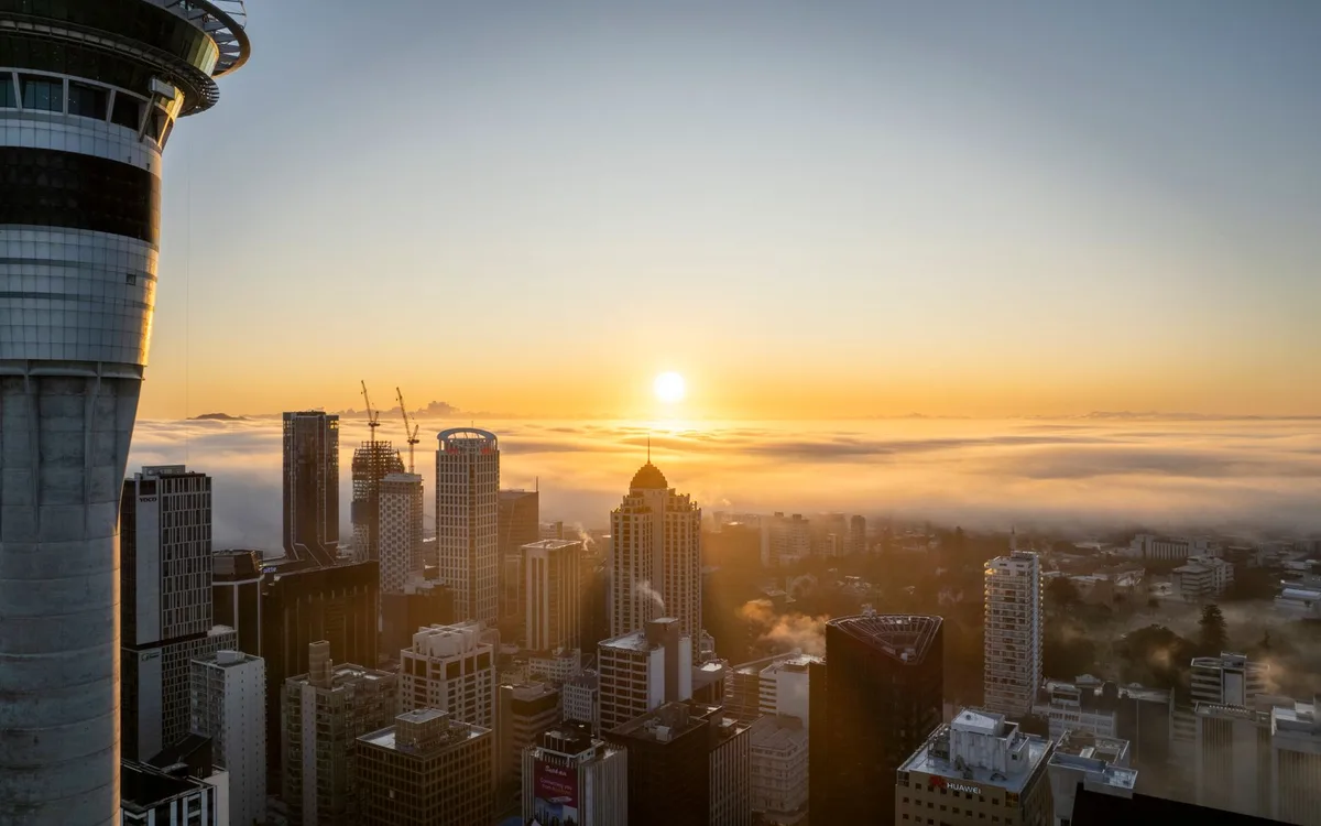 The Auckland city skyline and Sky Tower at sunset