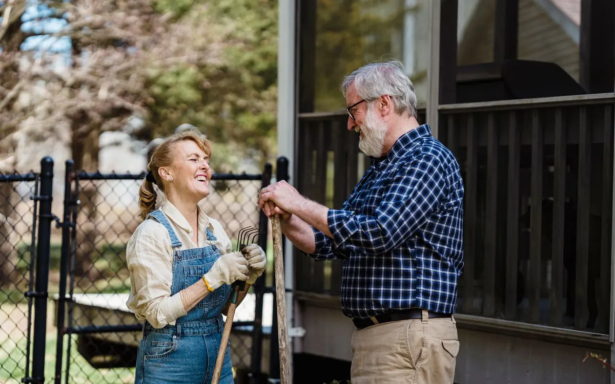 An older couple outdoors with family.
