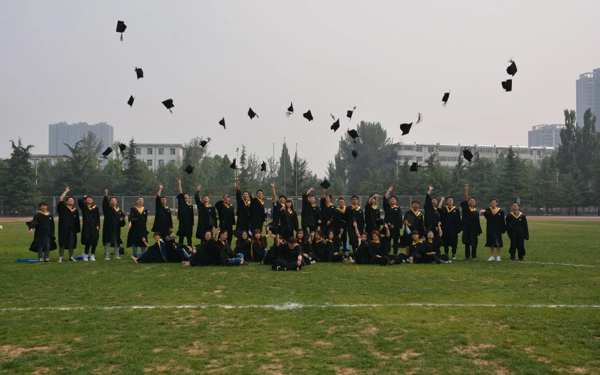 Graduates throwing their caps in the air after a ceremony