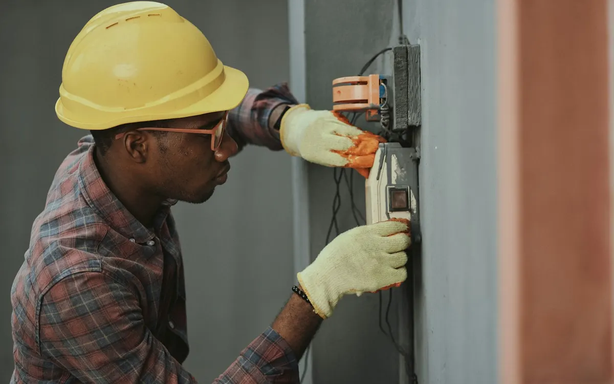 A tradesperson working with tools.
