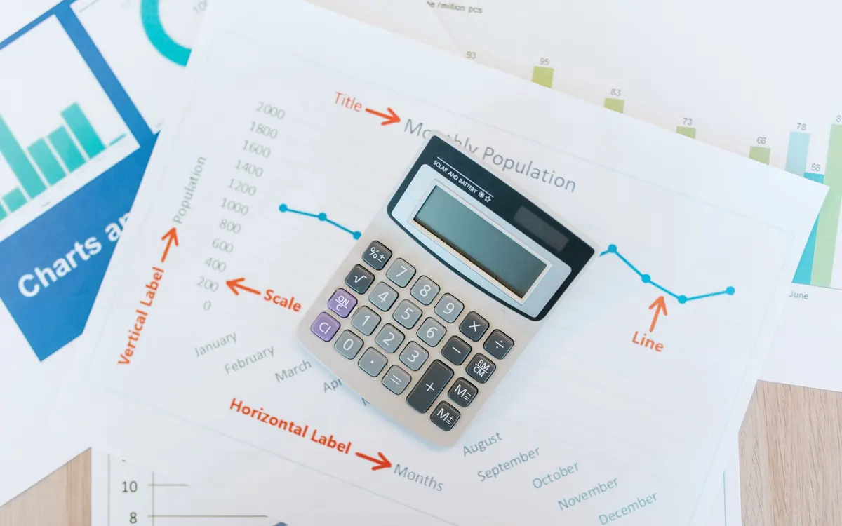 Reviewing fees and figures at a desk.