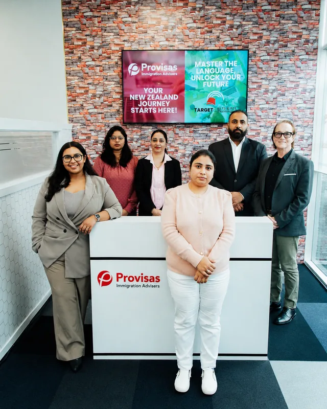 Provisas team at the Manukau office with the Target Language Academy 'Master the Language, Unlock your Future' partnership campaign on display.